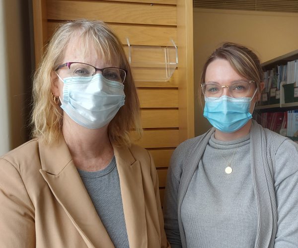 2 healthcare workers in masks