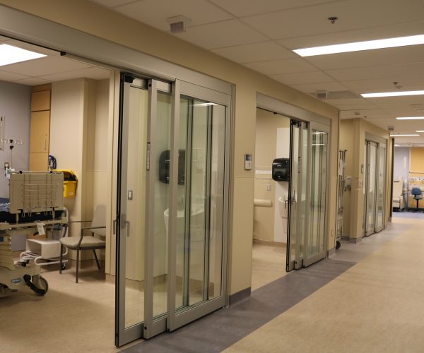 Image of a hospital hallway and rooms